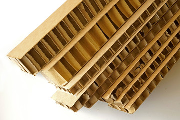 Sheets of brown corrugated cardboard used for filling in fragile parcels.