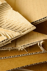 Fototapeta na wymiar Close-up of stacked corrugated cardboard. Sheets of brown corrugated cardboard.