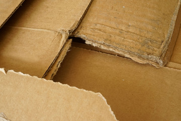 Obraz na płótnie Canvas Close-up of stacked corrugated cardboard. Sheets of brown corrugated cardboard.