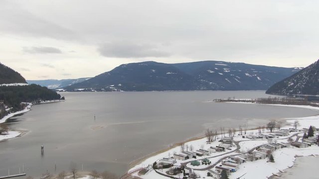Aerial View of a small Town, Sicamous, in the Interior of British Columbia, Canada. Taken during winter time.