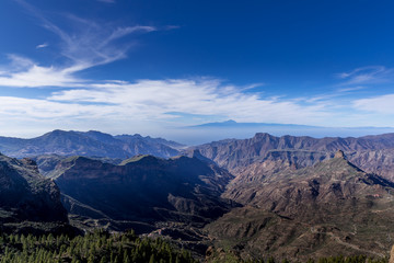 View of the tops of mountain ridges hills and rocks lining the landscape into the distance rises the ridges in the Canary Island National Park