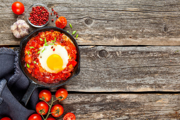 Shakshuka Scrambled eggs with tomatoes and vegetables. Breakfast. In the plate. Top view. Flat lay composition Free copy space.