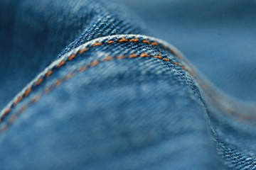 Jeans denim texture close up , focus only one point , soft blured background wallpaper