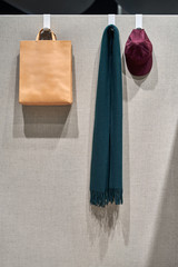 Luminous interior with hangers on gray partition