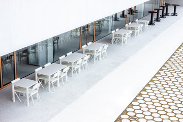 closed cafe white and black tables outside