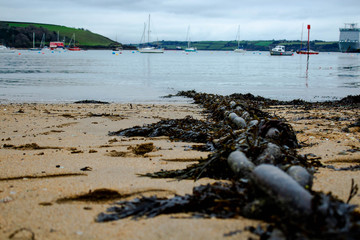 Large chain on a beach entering the sea in Falmouth, Cornwall