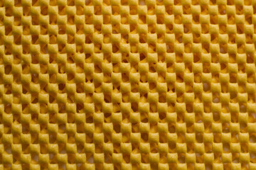 The yellow background is small squares. Texture