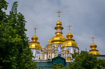 Fototapeta na wymiar Golden Domes of St. Michael's Golden-Domed Monastery is one of the famous church complex Kiev (Kyiv). Located opposite St. Sophia’s Cathedral. 