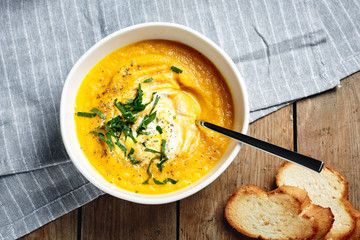 Pumpkin carrot cream soup with croutons.