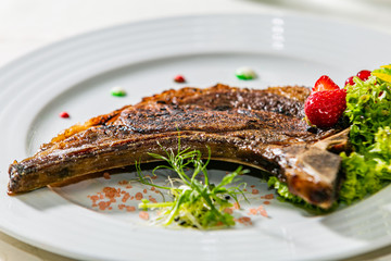 A delicious grilled beef steak with fresh salad. The food in the restaurant. Food styling and restaurant meal serving. Gourmet restaurant menu concept. Creative stylist restaurant