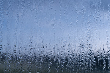 Naklejka na ściany i meble Blurred natural water drop window textured glass .
