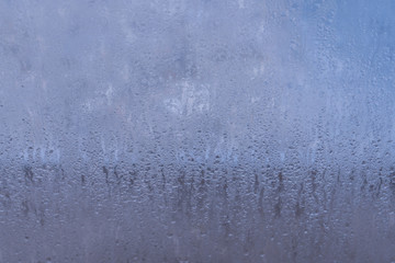 Naklejka na ściany i meble Blurred natural water drop window textured glass .