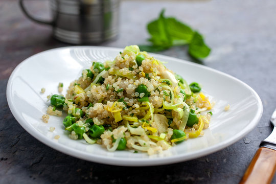 Quinoa&dagger;pilaf with sweet peas and green garlic