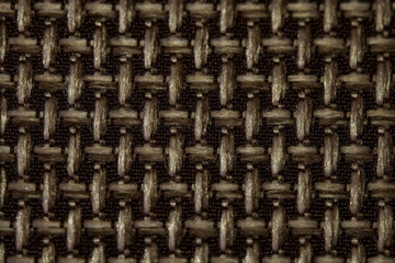 Fabric texture macro photo. Grunge texture. Fabric for furniture upholstery close-up. Rough weave of thick threads. Burlap close-up.