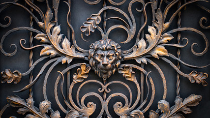 The fragment of forged metal products. lion, close-up