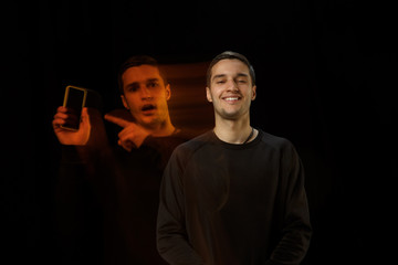 Smiling outside, need call inside. The versatility of man - opened emotions and hidden feelings. Caucasian man on black background with different faces of condition. Double exposure. Mental health.