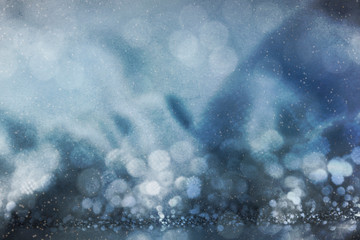 Blurred background with bokeh. Christmas and Happy New Year greeting card.