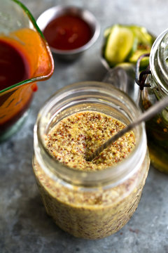 High angle view of jar of homemade grainy mustard