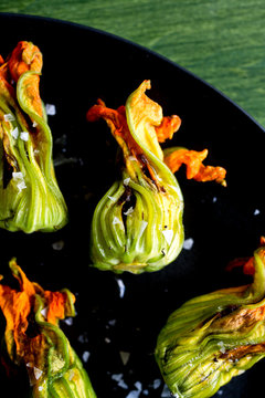 Close up of squash blossoms with†burrata†and†tapenade