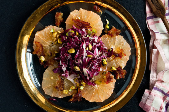 Pink grapefruit and radicchio salad with dates and pistachios