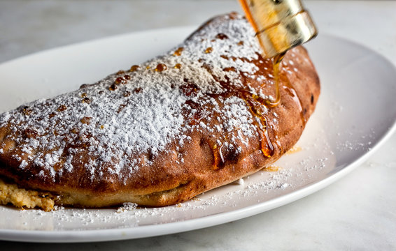 Cannoli cream calzone with honey and orange