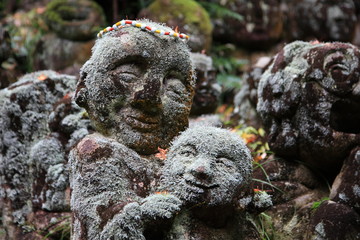Fototapeta premium Jizō (Japanese stone statues) at Otagi Nenbutu-ji temple in kyoto Japan