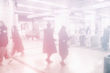 White Blurred People in the Subway Background.