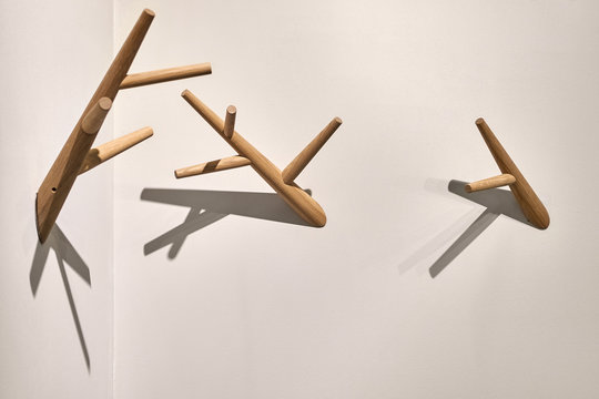 Closeup view at few wood hook hangers indoors