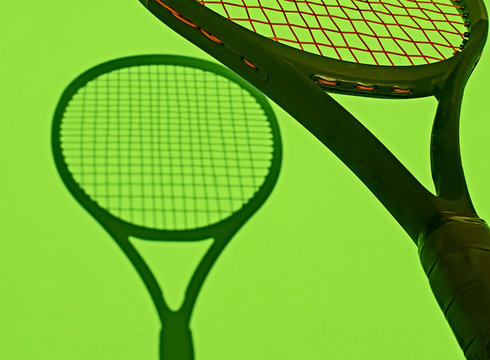 Close Up Of Tennis Racket With Shadow