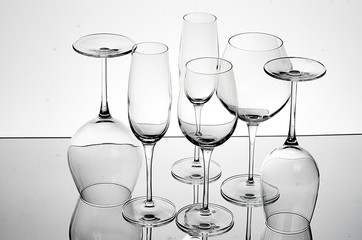Reflection of empty drink glasses on table