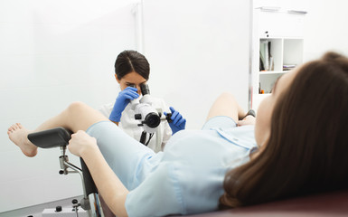 Colposcopy, examination of the cervix. A gynecologist examines the uterine cavity using a colposcope. Gyneoclogy, women's health