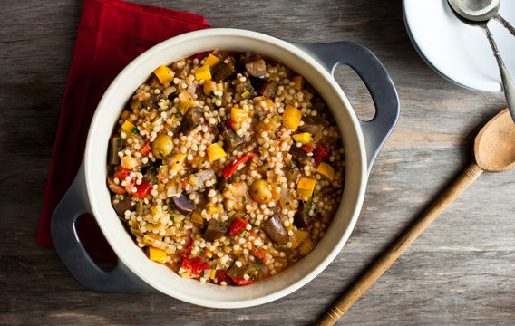 Overhead view of Israeli couscous with mixed summer vegetables