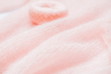 fluffy, knitted peach color texture