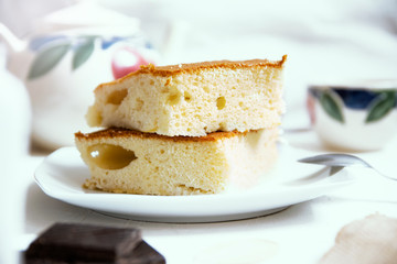 Homemade sponge cake baked at home during self isolation. Empty copy space for Editor's text.