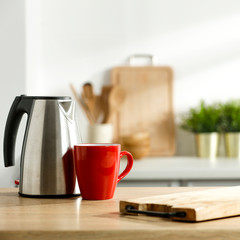 Table background of free space and kitchen interior with white wall and shadows.Copy space for your composition. 