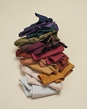 Stack of colorful jeans