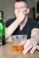 man drinking whisky