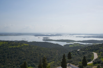 Alentejo drone aerial view of the landscape at sunset with alqueva dam reservoir, in Portugal