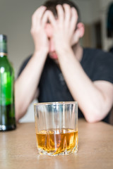 young man drinking whiskey