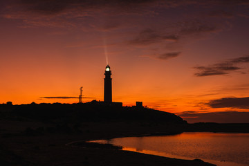 Amazing landscape of lighthouse trafalgar in cadiz at sunset nigth with light
