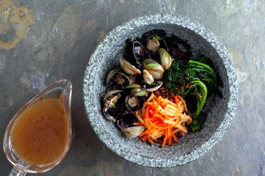 Bibimpap with clams, kale, daikon and carrots