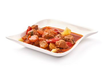 Stew Meat, stewed pork goulash with potaotoes, isolated on white background