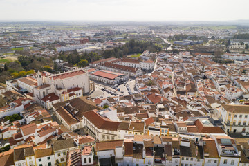 Evora drone aerial view on a sunny day with historic buildings city center and church in Alentejo, Portugal