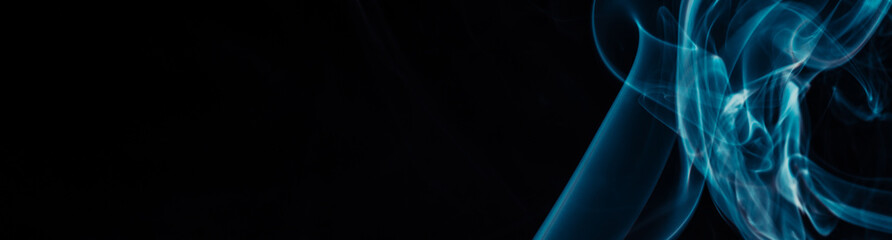 Blue smoke on black background