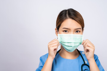 Portrait of young asian nurse wearing surgical mask
