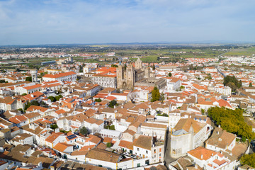 Obraz premium Evora drone aerial view on a sunny day with historic buildings city center and church in Alentejo, Portugal