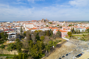Fototapeta na wymiar Evora drone aerial view on a sunny day with historic buildings city center and church in Alentejo, Portugal