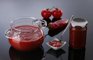 Canned peeled tomato cubes in a glass jar