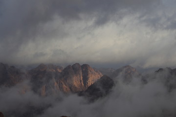 clouds hit the mountain