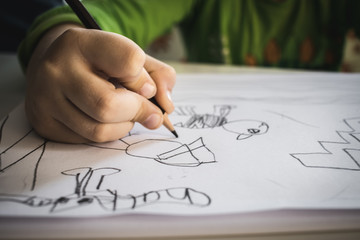 Child boyDrawing With Colourful Pencils